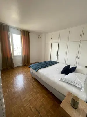 Un ou plusieurs lits dans un hébergement de l'établissement magnifique appartement