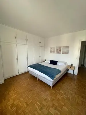 Un ou plusieurs lits dans un hébergement de l'établissement magnifique appartement