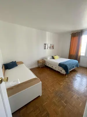 Un ou plusieurs lits dans un hébergement de l'établissement magnifique appartement