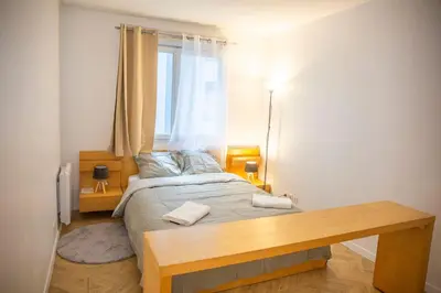 Un ou plusieurs lits dans un hébergement de l'établissement Grand 2 pièces balcon Parking porte PARIS