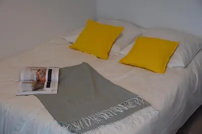Un ou plusieurs lits dans un hébergement de l'établissement Cosy Studio