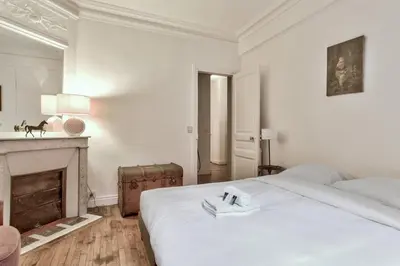 Un ou plusieurs lits dans un hébergement de l'établissement Appartement Caulain - Welkeys