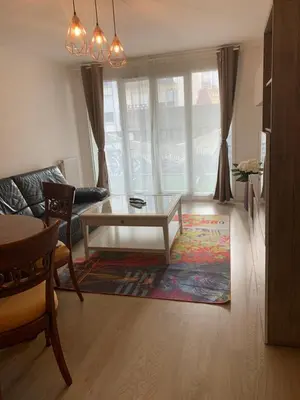Coin salon dans l'établissement Bel appartement de 65 m2 - bail mobilité