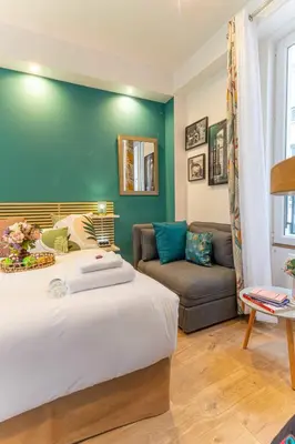 Un ou plusieurs lits dans un hébergement de l'établissement Lovely studio -Center of Paris