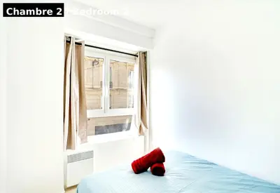 Un ou plusieurs lits dans un hébergement de l'établissement Magnifique 3 pièces Paris 18ème