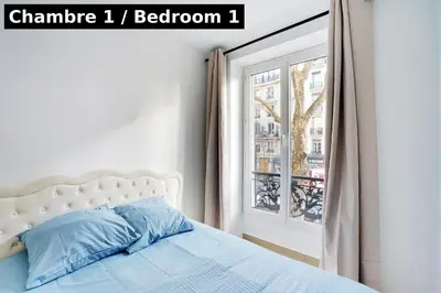 Un ou plusieurs lits dans un hébergement de l'établissement Magnifique 3 pièces Paris 18ème