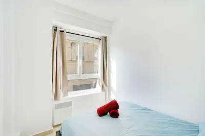 Un ou plusieurs lits dans un hébergement de l'établissement Magnifique 3 pièces Paris 18ème