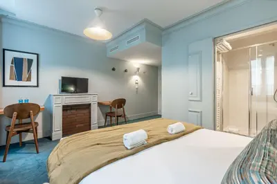 Un ou plusieurs lits dans un hébergement de l'établissement Le Nest by Sweett