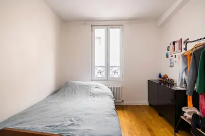 Un ou plusieurs lits dans un hébergement de l'établissement Country home in Paris