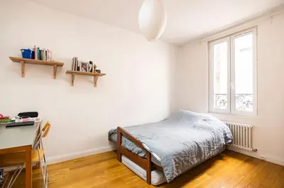Un ou plusieurs lits dans un hébergement de l'établissement Country home in Paris