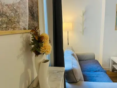 Coin salon dans l'établissement Cozy historic appartement near Exelmans in 16th District Paris