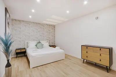 Un ou plusieurs lits dans un hébergement de l'établissement Pick A Flat's Apartment in La Chapelle - Impasse du Curé