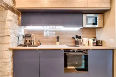 Cuisine ou kitchenette dans l'établissement Cozy apartement heart historic Paris