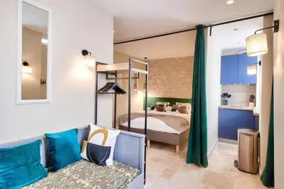 Un ou plusieurs lits dans un hébergement de l'établissement Cozy apartement historic Center Paris & Montmartre