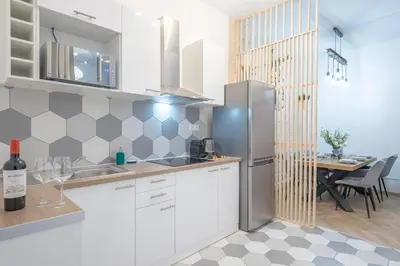 Cuisine ou kitchenette dans l'établissement Bohemian Flat - Lovely Marais