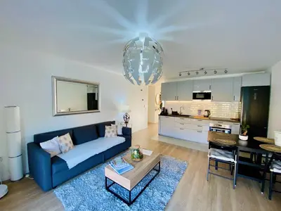 Cuisine ou kitchenette dans l'établissement Bright Spacious Apartment near Paris Metro 4