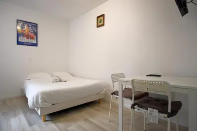 Un ou plusieurs lits dans un hébergement de l'établissement Studio cosy au calme Paris 15ᵉ