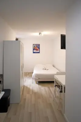 Un ou plusieurs lits dans un hébergement de l'établissement Studio cosy au calme Paris 15ᵉ