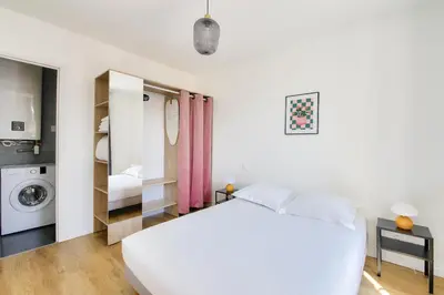 Un ou plusieurs lits dans un hébergement de l'établissement Résidence Paris Ivry House