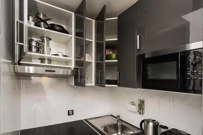 Cuisine ou kitchenette dans l'établissement Charmant studio près des Champs-Élysées