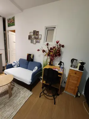 Coin salon dans l'établissement Home Cosy ARENA Porte de la Chapelle