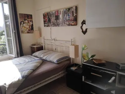 Un ou plusieurs lits dans un hébergement de l'établissement PARIS centre 30m2- cuisine-Métro Glacière