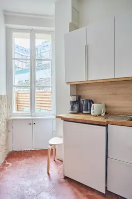 Cuisine ou kitchenette dans l'établissement Residence Tour Eiffel by Studio prestige