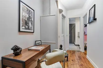 Télévision ou salle de divertissement dans l'établissement Residence Tour Eiffel by Studio prestige