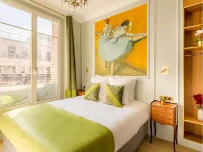 Un ou plusieurs lits dans un hébergement de l'établissement Merveil - Luxury Suite - Louvre - Opera I