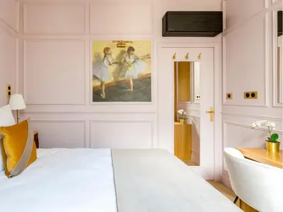 Un ou plusieurs lits dans un hébergement de l'établissement Merveil - Luxury Suite - Louvre - Opera I