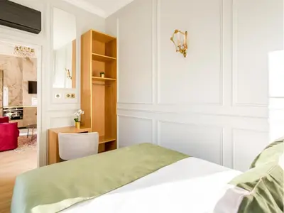 Un ou plusieurs lits dans un hébergement de l'établissement Merveil - Luxury Suite - Louvre - Opera II