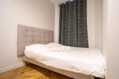 Un ou plusieurs lits dans un hébergement de l'établissement Apartment near Montmartre