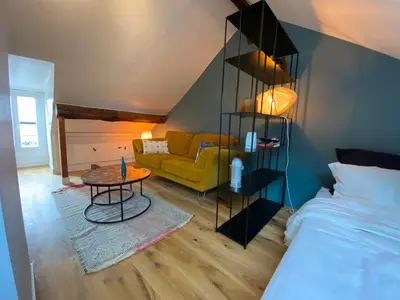 Un ou plusieurs lits dans un hébergement de l'établissement Le Loft Lepic