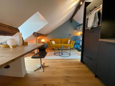 Télévision ou salle de divertissement dans l'établissement Le Loft Lepic