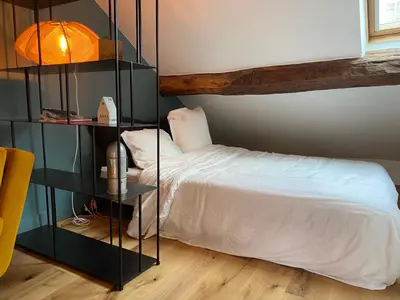 Un ou plusieurs lits dans un hébergement de l'établissement Le Loft Lepic
