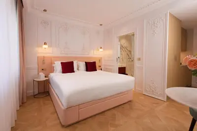 Un ou plusieurs lits dans un hébergement de l'établissement Mode Paris Aparthotel