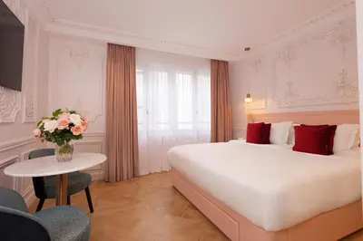 Un ou plusieurs lits dans un hébergement de l'établissement Mode Paris Aparthotel