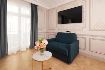 Télévision ou salle de divertissement dans l'établissement Mode Paris Aparthotel