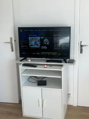 Télévision ou salle de divertissement dans l'établissement Cómodo Apartamento
