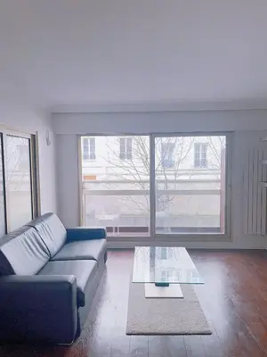Coin salon dans l'établissement Belle chambre Champs-Élysée