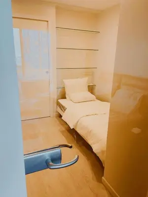 Un ou plusieurs lits dans un hébergement de l'établissement Belle chambre Champs-Élysée