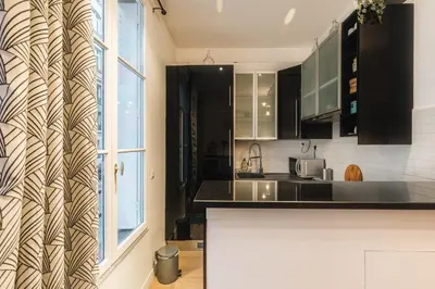 Cuisine ou kitchenette dans l'établissement Charmant 34 m au cœur de Montmartre