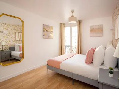 Un ou plusieurs lits dans un hébergement de l'établissement Merveil Family Suite - Champs Elysees - Roosevelt