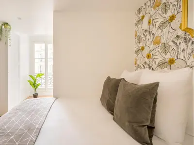 Un ou plusieurs lits dans un hébergement de l'établissement Merveil Family Suite - Champs Elysees - Roosevelt