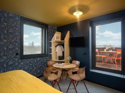 Un ou plusieurs lits dans un hébergement de l'établissement Eklo Hotels Paris Porte de Versailles