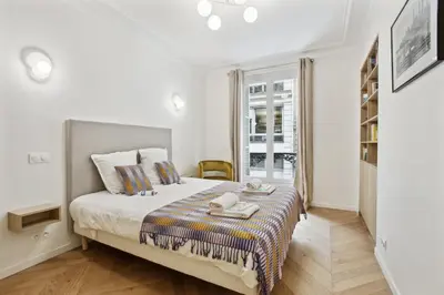 Un ou plusieurs lits dans un hébergement de l'établissement 270 Suite Haute - Superb apartment in Paris.