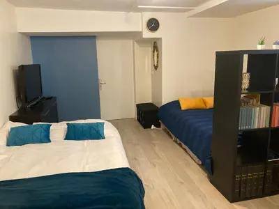 Un ou plusieurs lits dans un hébergement de l'établissement Une chambre chez nous, à 12 minutes de Paris