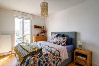 Un ou plusieurs lits dans un hébergement de l'établissement Stunning apartment with balcony to visit Paris