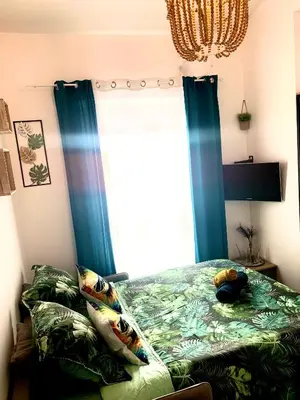 Un ou plusieurs lits dans un hébergement de l'établissement Paris studio cosy climatisé