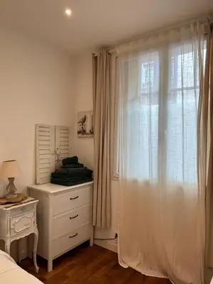 Un ou plusieurs lits dans un hébergement de l'établissement Appart à deux pas de paris expo
